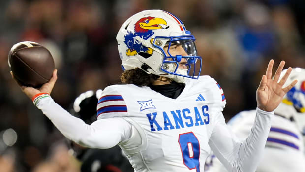 Kansas Jayhawks quarterback Jason Bean (9) prepares to throw a pass during the NCAA college football game between the Cincinnati Bearcats and Kansas Jayhawks on Saturday, Nov. 25, 2023, at Nippert Stadium in Cincinnati. This is the Bearcats last game of the season, as well as their Senior Night Saturday.  